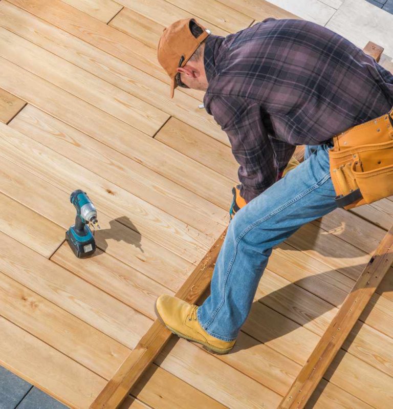 Missouri roofer inspecting storm damage on residential roof