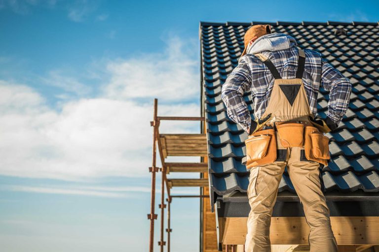 Roofer working on a sloped roof